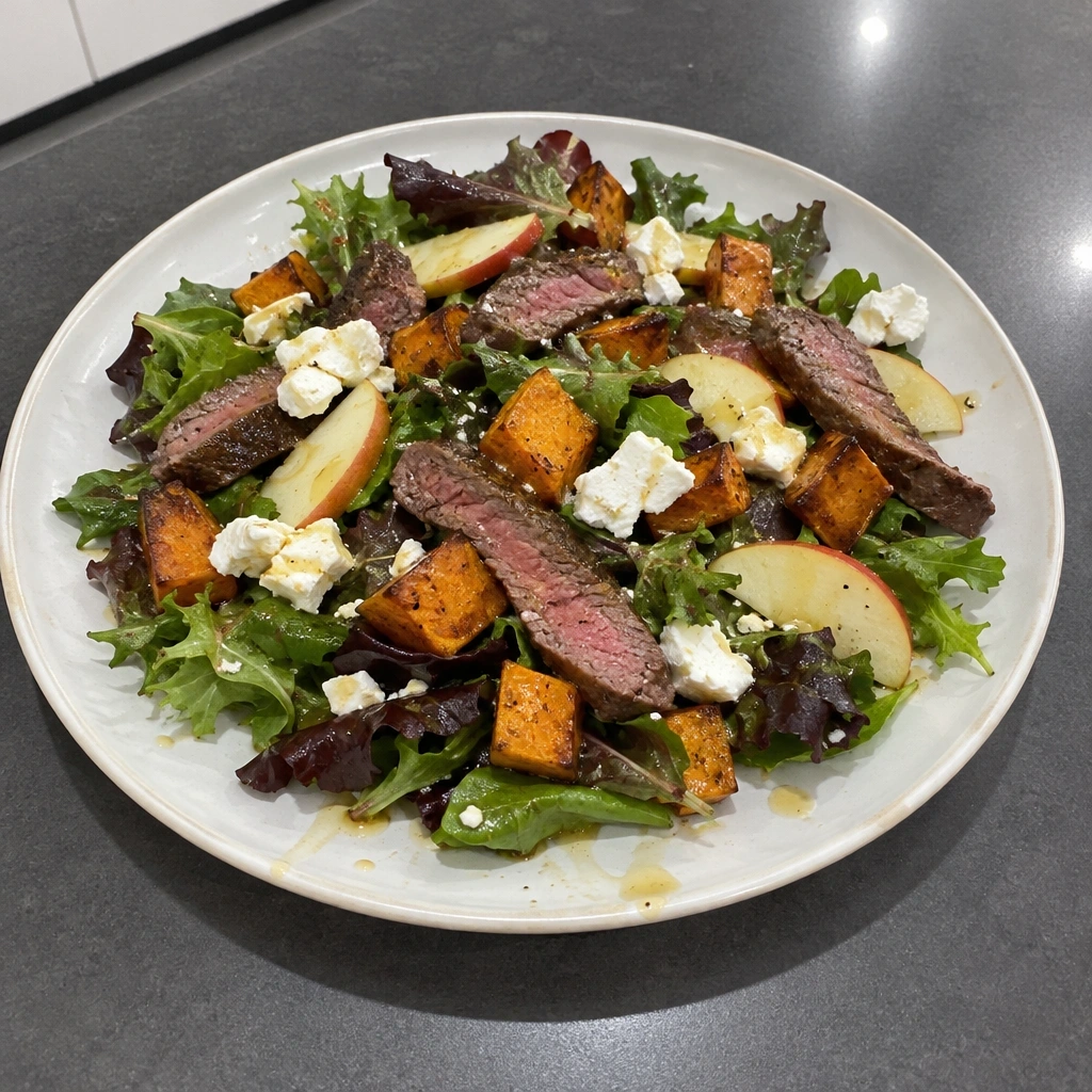 Salade tiède de bifteck d'aloyau, chèvre, pommes et patates douces rôties